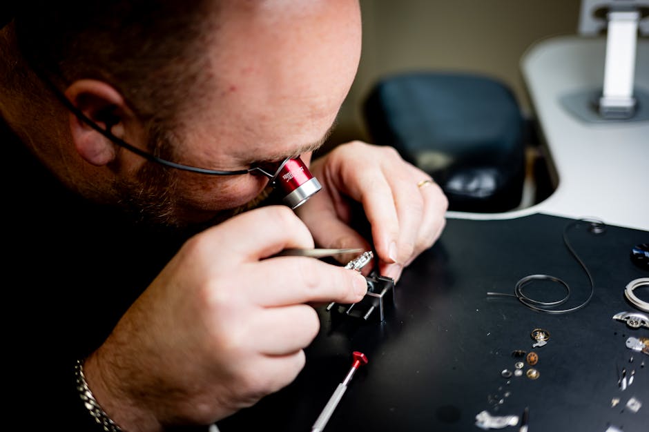 Watchmaker meticulously fine-tuning a watch mechanism with precision tools.